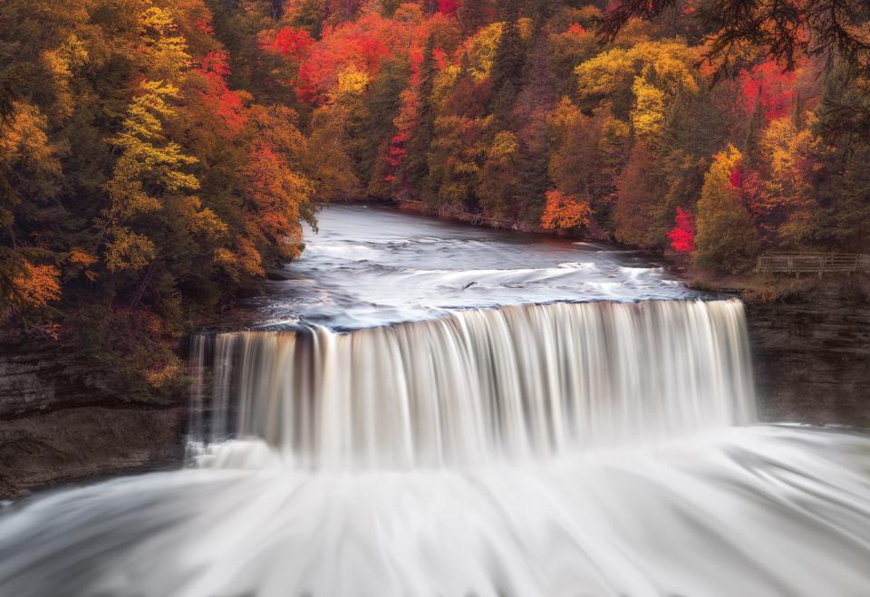 <p>A waterfall flows through Tahquamenon Falls State Park in Michigan.</p>