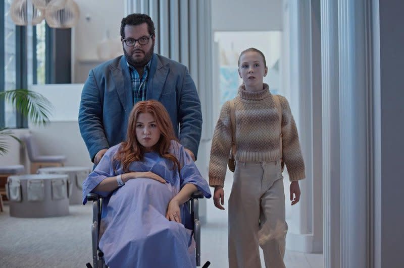From left to right, Josh Gad, Isla Fisher and Ariel Donoghue star in "Wolf Like Me." Photo courtesy of Peacock
