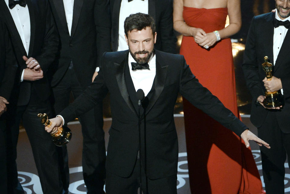 HOLLYWOOD, CA - FEBRUARY 24:  Actor/producer/director Ben Affleck accepts the Best Picture award for “Argo” onstage along with members of the cast and crew during the Oscars held at the Dolby Theatre on February 24, 2013 in Hollywood, California.  (Photo by Kevin Winter/Getty Images)