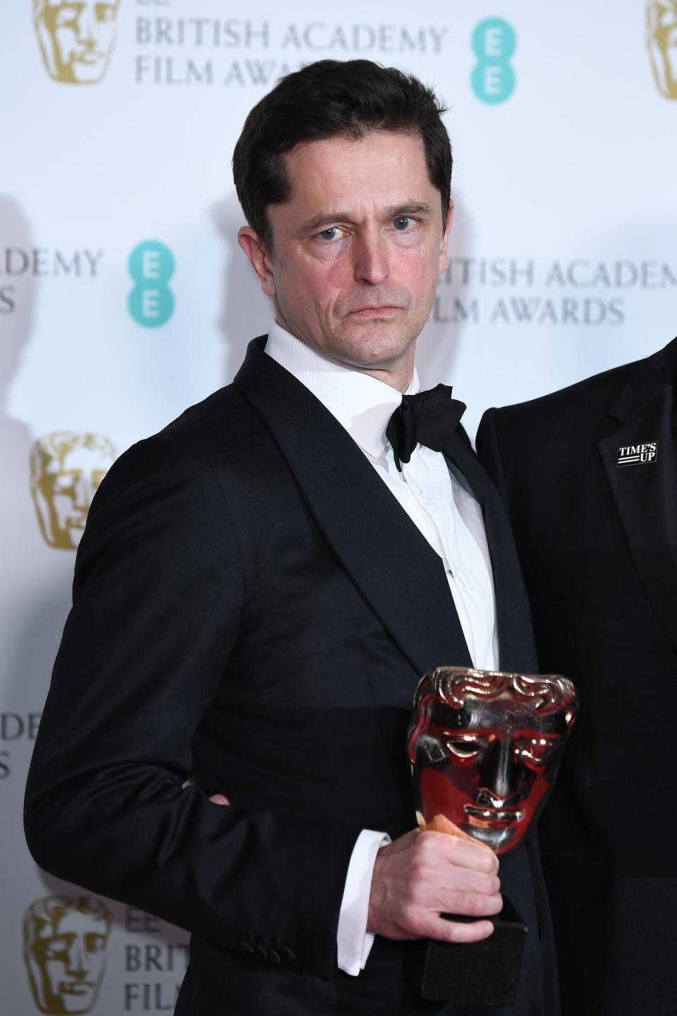 Pete Czernin, poses with his BAFTA Outstanding British Film award in 2018 (Jeff Spicer/Getty Images)