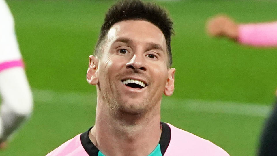 Pictured here, Lionel Messi smiles during a match for Barcelona.