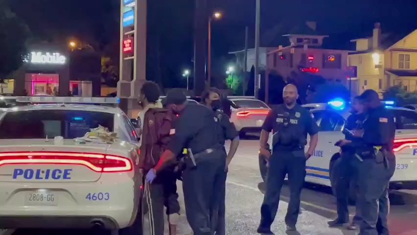 A man being taken into custody at the Walgreens at McLean Boulevard and Union Avenue Wednesday. A witness and police said there was an altercation between a man and an officer.