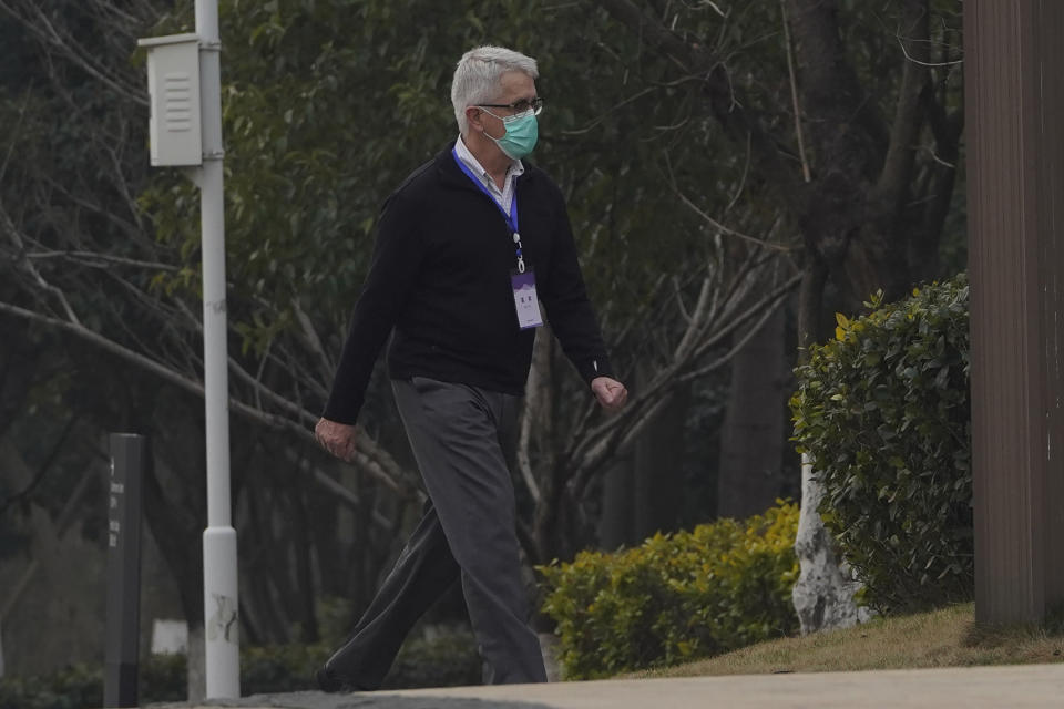 Dominic Dwyer of a World Health Organization team walks in the cordoned hotel area in Wuhan in central China's Hubei province on Thursday, Feb. 4, 2021. The WHO team is investigating the origins of the coronavirus pandemic in the province. (AP Photo/Ng Han Guan)