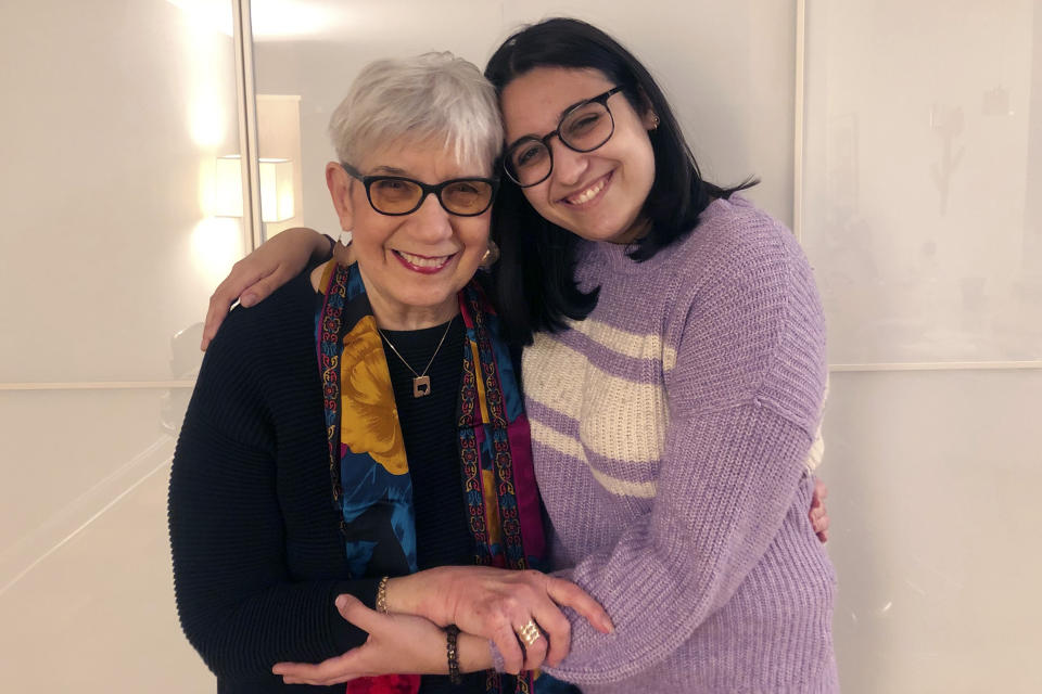 In this photo, provided by Laura Shaw Frank, Evelyn Shaw hugs her granddaughter, Ateret Frank, in the Bronx borough of New York, on Thursday, March 11, 2021. After a year without touch, a family doctor cleared Shaw for hugs as a prescription, once she and her 23-year-old granddaughter received full doses of the COVID-19 vaccine. (Laura Shaw Frank via AP)