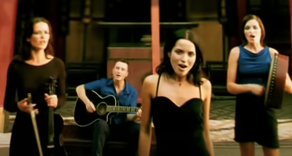 The Corrs performs "Dreams" with a guitar, violin, and drum