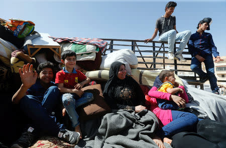 FILE PHOTO: Syrian refugees prepare to return to Syria from the Lebanese border town of Arsal, Lebanon June 28, 2018. REUTERS/Mohamed Azakir