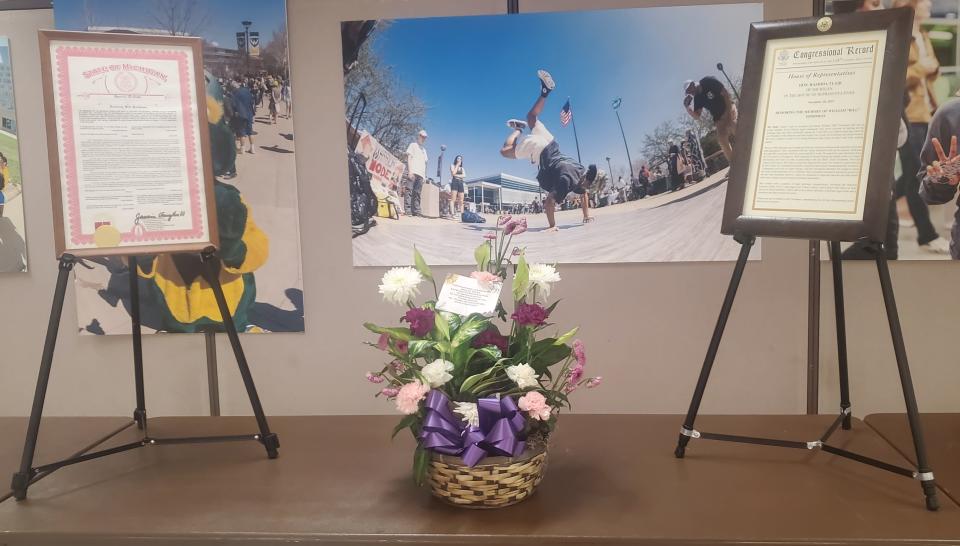 Commemorative plaques and flowers dedicated to the late human rights lawyer Bill Goodman at a memorial event at Wayne State University's Community Arts Auditorium June 29, 2024.