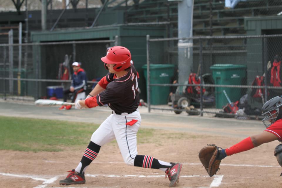 Rogers High School's Shane Marshall follows through on a swing in a recent game against Central Falls. On Tuesday, Marshall stroked a double, single and drove home two runs to help the Vikings to a 9-1 win over the Times2 Academy/Paul Cuffee School co-op team.
