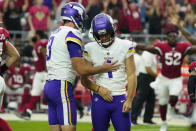 Minnesota Vikings punter Jordan Berry (3) consoles kicker Greg Joseph (1) during the second half of an NFL football game against the Arizona Cardinals, Sunday, Sept. 19, 2021, in Glendale, Ariz. The Cardinals won 34-33. (AP Photo/Rick Scuteri)