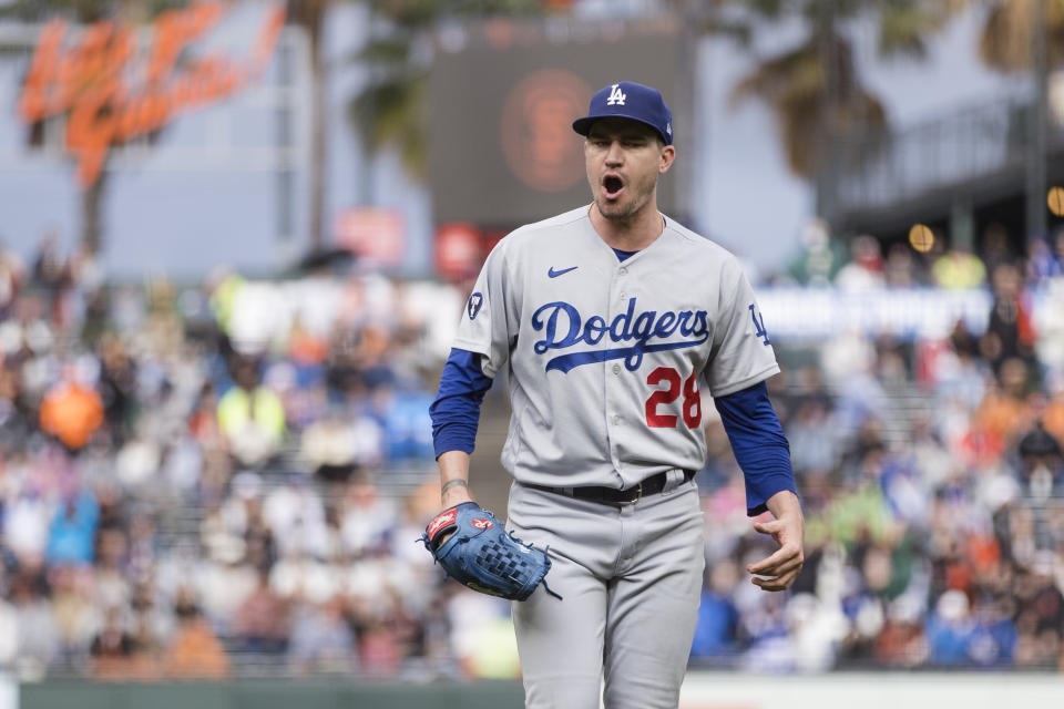 Los Angeles Dodgers pitcher Andrew Heaney reacts after ending the inning with San Francisco Giants runners on second and third base during the fourth inning of a baseball game in San Francisco, Sunday Sept. 18, 2022. (AP Photo/John Hefti)