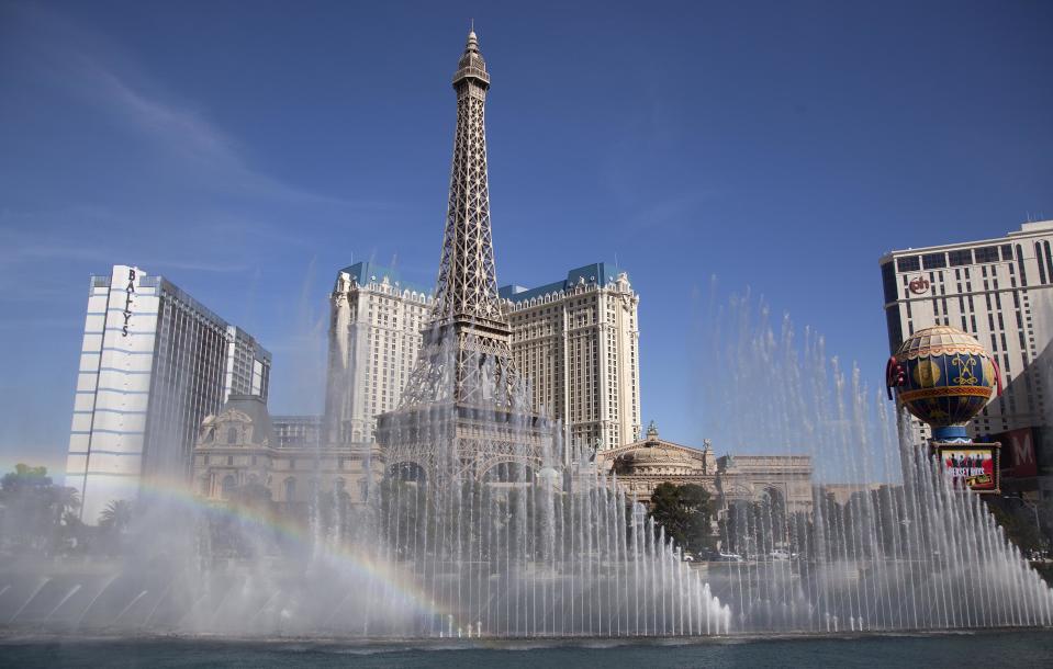 FILE - This March 20, 2012 file photo shows the Bellagio fountain spraying in sync with music during one of its afternoon shows in Las Vegas. The Bellagio resort, with its romantic Italian-inspired architecture, is something of a crown jewel in the heart of the Strip. But when night falls, the real stars are the majestic dancing fountains that emerge from the vast man-made lake in front of the hotel. Illuminated columns of water shoot from hundreds of powerful pipes below the lake's surface, soaring to impossible heights and moving in sync to songs by Andrea Bocelli, Faith Hill and The Beatles. (AP Photo/Julie Jacobson, file)