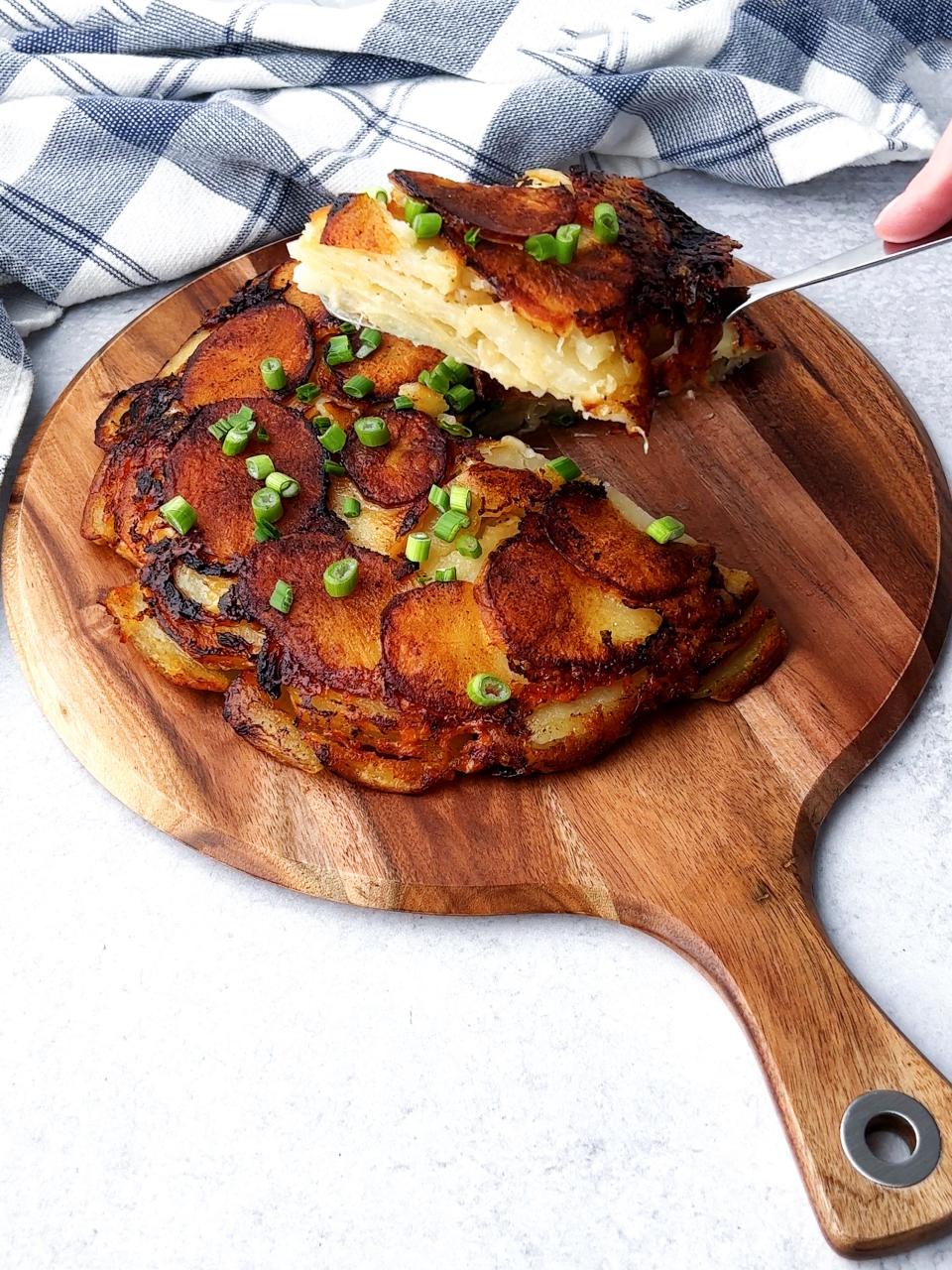 Irish Pan Haggerty layers potatoes, onions, butter, cheese into a crispy baked dish.