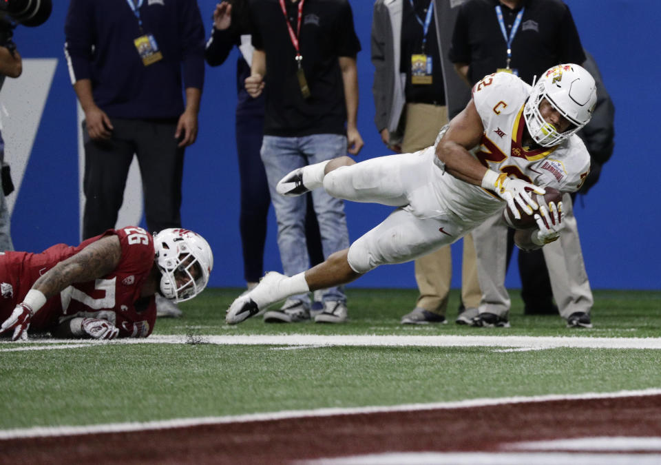 Iowa State running back David Montgomery (32) is tripped up short of the goal line by Washington State defensive back Hunter Dale (26) during the second half of the Alamo Bowl NCAA college football game, Friday, Dec. 28, 2018, in San Antonio. (AP Photo/Eric Gay)