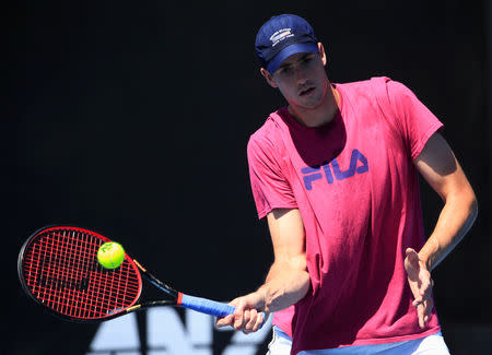 FILE PHOTO: Tennis - Australian Open - Melbourne Park, Melbourne, Australia - January 13, 2019 - John Isner of the U.S. trains. REUTERS/Aly Song