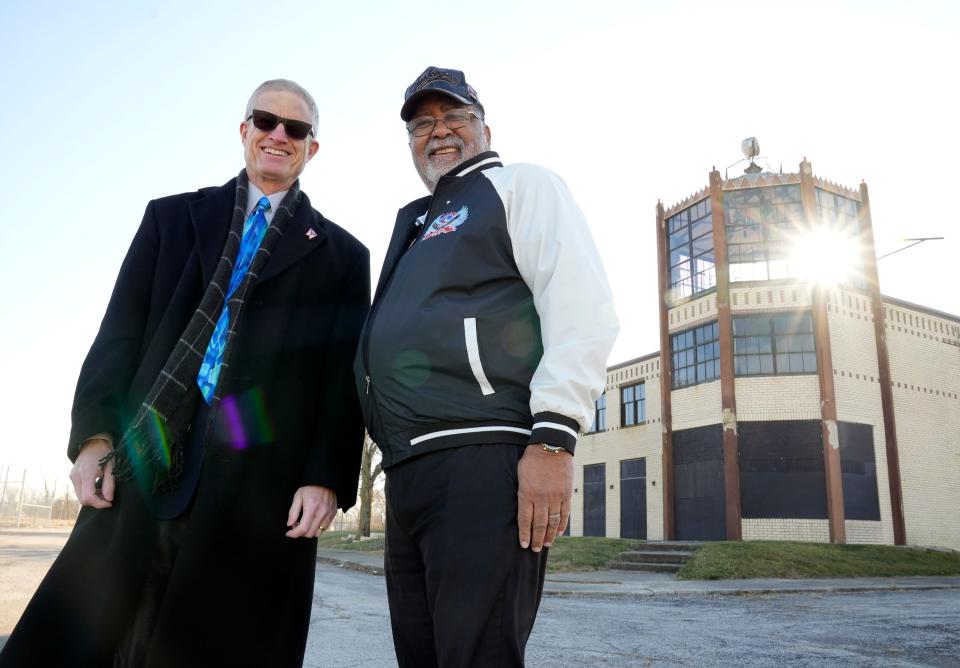 Ron Kaplan, left, and John Mitchell, a retired Air Force captain, pose in front of the original 1929-era Port Columbus terminal on Fifth Avenue. Kaplan is leading a group working to renovate the terminal into an aviation hall of fame and museum.