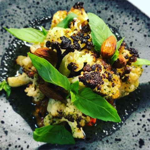 salt baked cauliflower with romesco and herb oil at Limetree Kitchen