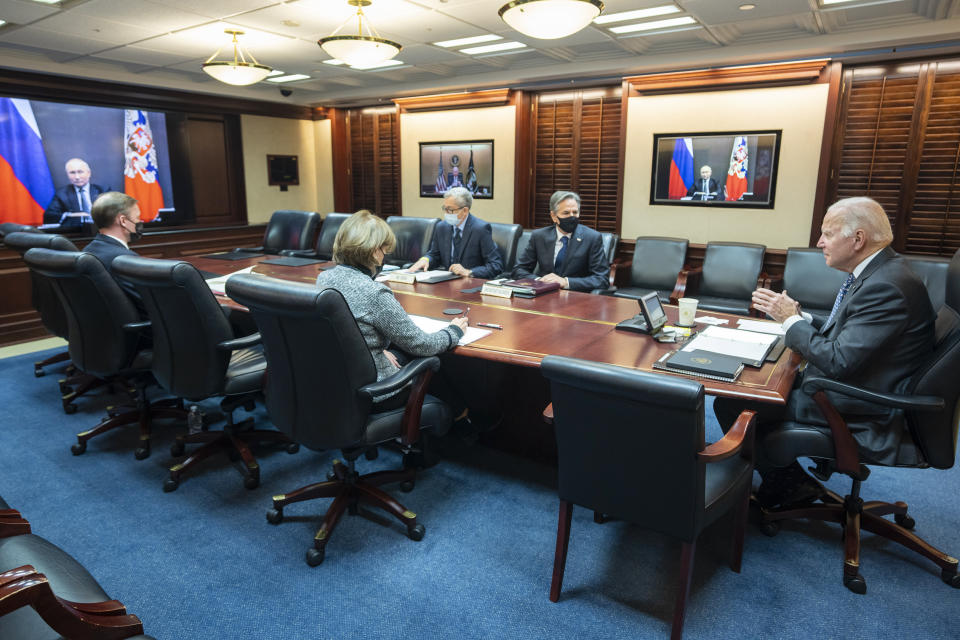 In this image provided by The White House, President Joe Biden speaks as he meets virtually via a secure video conference with Russian President Vladimir Putin from the Situation Room at the White House in Washington, Tuesday, Dec. 7, 2021. At far left is White House national security adviser Jake Sullivan along with Secretary of State Antony Blinken, right, national security council senior director for Russian and Central Asia, Eric Green. Biden says the U.S. would take a more direct role in diplomacy to address Vladimir Putin’s issues with Ukraine and Europe at large, if Putin forgoes any new invasion of Ukraine. (Adam Schultz/The White House via AP)