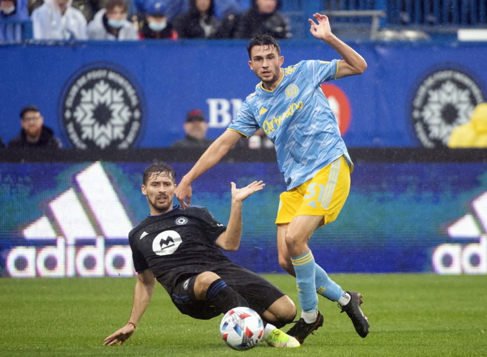 CF Montreal's Matko Miljevic, left, challenges Philadelphia Union's Leon Flach during the second half of an MLS soccer game, Saturday, Oct. 16, 2021, in Montreal. (Graham Hughes/The Canadian Press via AP)