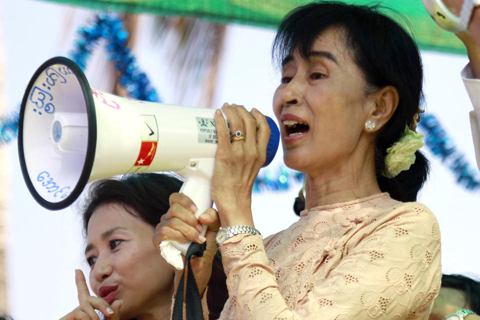 FILE - Myanmar pro-democracy icon Aung San Suu Kyi speaks to her supporters during her election campaign in Myeik, Myanmar on March 24, 2012. Myanmar court on Monday, Dec. 6, 2021, sentenced ousted leader Suu Kyi to 4 years for incitement and breaking virus restrictions, then later in the day state TV announced that the country's military leader reduced the sentence by two years. (AP Photo/Khin Maung Win, File)