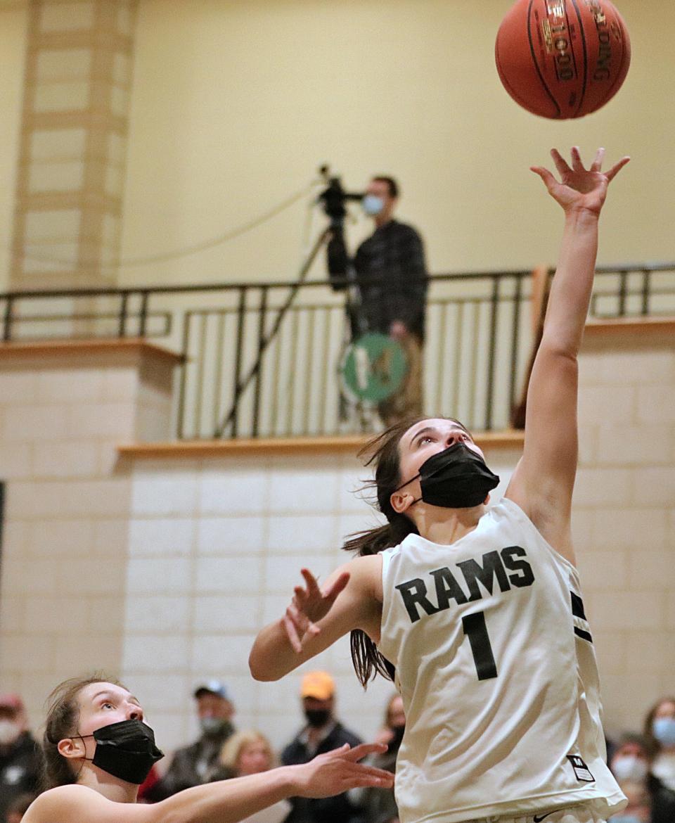 Marshfield's Danielle Bergeron finishes a layup during a game against Duxbury at Marshfield High School on Friday, Jan. 28, 2022.