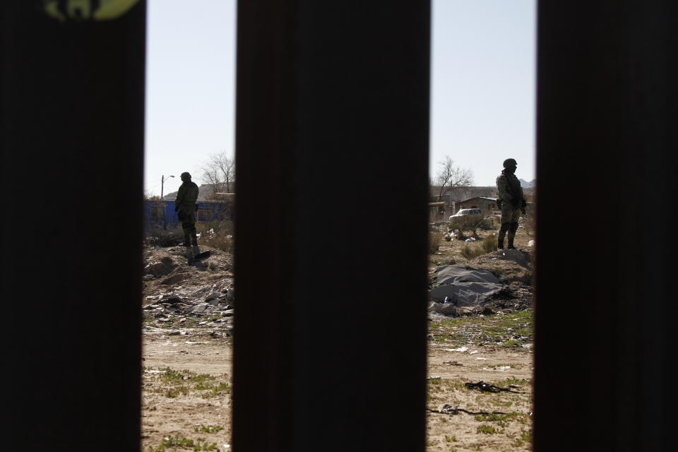 Mexican National Guard troops patrolling the country's northern border are seen from Sunland Park, New Mexico on Friday, Jan. 31, 2020, in the nearby town of Sunland Park, New Mexico. The troops have been deployed on and off to the region, which includes Ciudad Juarez, Mexico, following a threat in 2019 from President Donald Trump to impose tariffs on Mexican exports. (AP Photo/Cedar Attanasio)