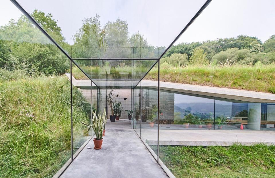 The glass corridor leading into the newest part of the home.