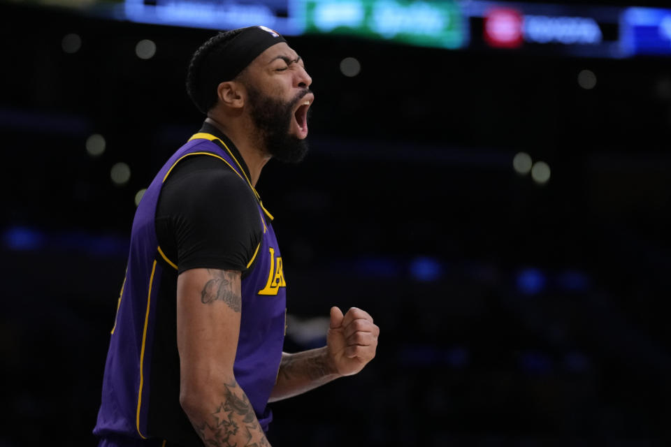 Los Angeles Lakers forward Anthony Davis (3) reacts after a foul call during the second half of an NBA basketball game against the Brooklyn Nets in Los Angeles, Friday, Jan. 19, 2024. (AP Photo/Ashley Landis)