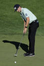 Mackenzie Hughes, of Canada, putts on the 18th green during the second round of the Travelers Championship golf tournament at TPC River Highlands, Friday, June 26, 2020, in Cromwell, Conn. (AP Photo/Frank Franklin II)