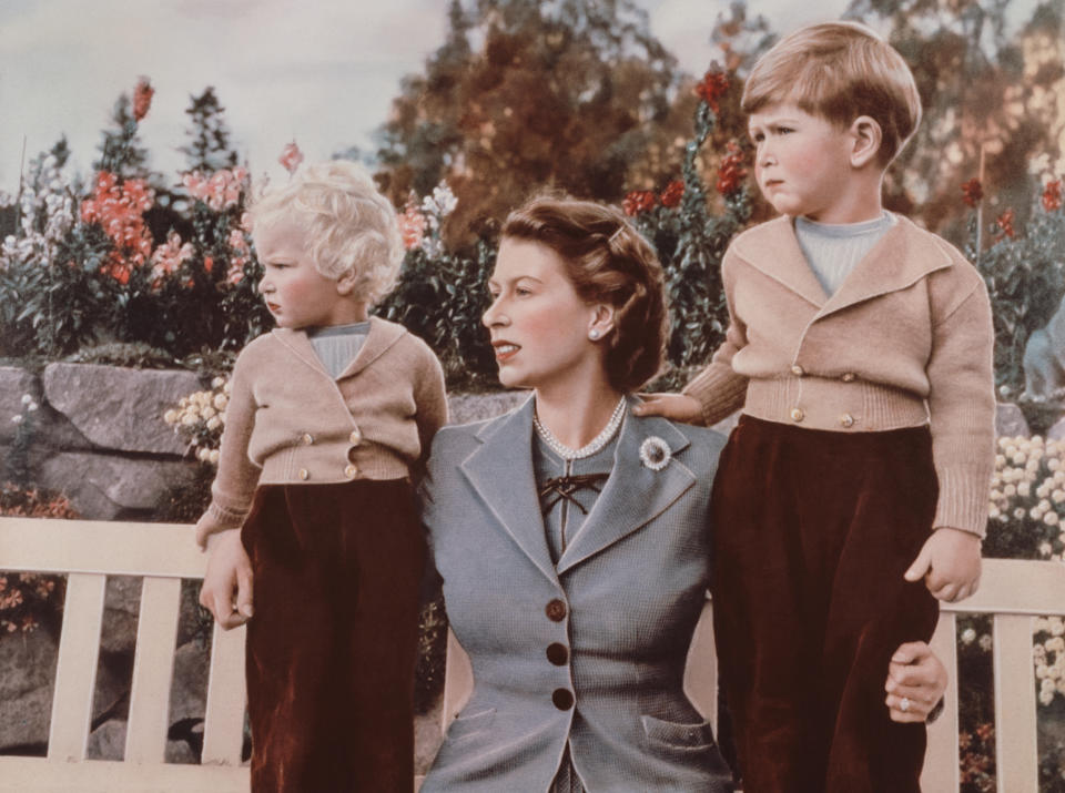 Queen Elizabeth II with Prince Charles, age 4, and Princess Anne in the grounds of Balmoral Castle, Scotland, Sept. 1952. Charles is celebrating his 4th birthday. (Lisa Sheridan / Getty Images)