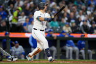 Seattle Mariners' Cal Raleigh follows through on an RBI single to score Julio Rodríguez against the Kansas City Royals during the third inning of a baseball game Monday, May 13, 2024, in Seattle. (AP Photo/Lindsey Wasson)