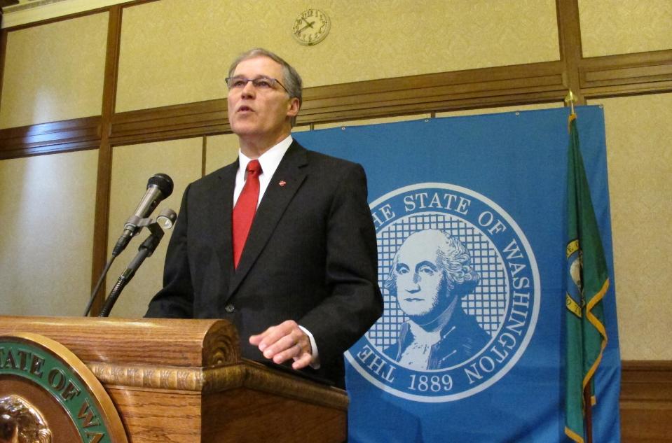 Gov. Jay Inslee announces Tuesday, Feb. 11, 2014, that he is suspending the use of the death penalty in Washington state during a news conference in Olympia, Wash. Inslee's moratorium, which will be in place for as long as he is governor, means that if a death penalty case comes to his desk, he will issue a reprieve, which isn't a pardon and doesn't commute the sentences of those condemned to death. (AP Photo/Rachel La Corte)