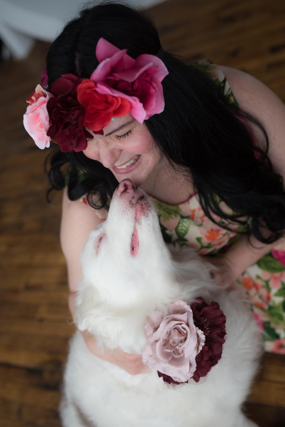 Kristen Strouse models with her dog, Raina, who is a semi-finalist for this year's "Oscars for dogs" in recognition of her community service work and perseverance while being born blind and deaf.