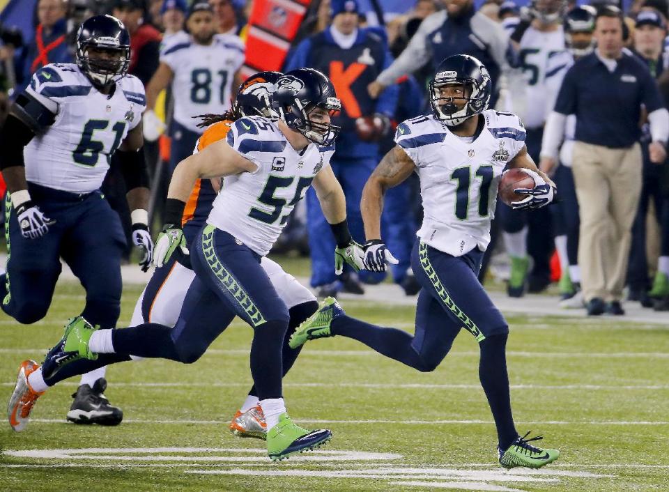 Seattle Seahawks wide receiver Percy Harvin (11) returns a kickoff for a touchdown against the Denver Broncos during the second half of the NFL Super Bowl XLVIII football game, Sunday, Feb. 2, 2014, in East Rutherford, N.J. (AP Photo/Matt York)