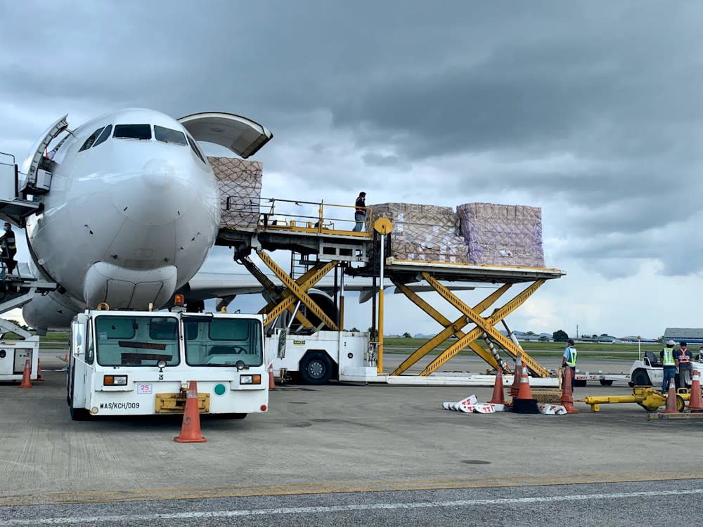 The unloading of the personal protective equipment from the plane at the Kuching International Airport, April 9, 2020. — Picture courtesy of Sarawak Public Communications Unit (UKAS)