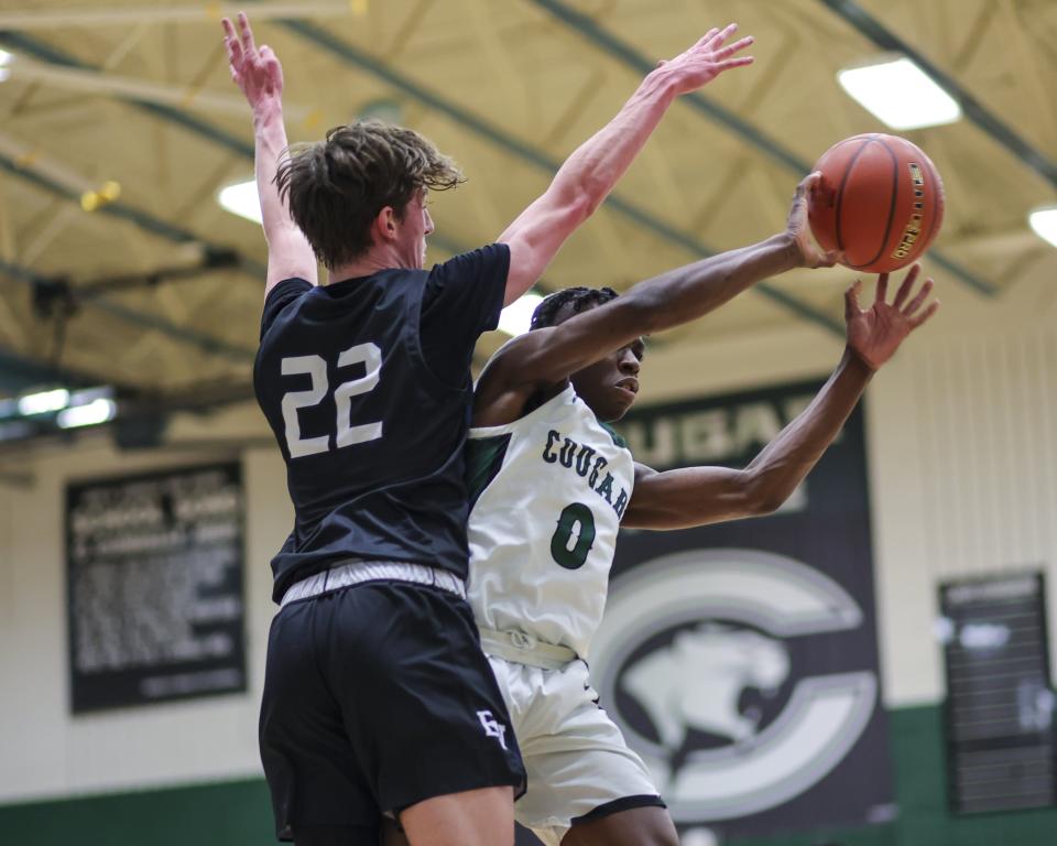 Connally's Kendal White, right, battles East View's Jakson Derr during the Cougars' 62-53 win in a District 23-5A game Friday night at Connally High School. The Cougars remained unbeaten in district play.