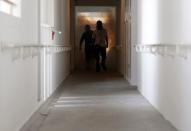 A National Environment Agency officer and a worker fogs the corridor of a public housing estate in the vicinity where a locally transmitted Zika virus case was discovered, in Singapore August 29, 2016. REUTERS/Edgar Su