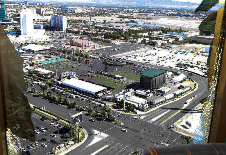 FILE - This Oct. 2017 photo released by the Las Vegas Metropolitan Police Department Force Investigation Team Report shows the view of Las Vegas Village from Mandalay Bay's room 32-135, part of the evidence images included on a preliminary report showing the interior of Stephen Paddock's 32nd floor room of the Mandalay Bay hotel in Las Vegas. Casino giant MGM Resorts International says more than 4,000 people are seeking compensation related to the Las Vegas Strip shooting that left 58 people dead, and it’s suing its insurance company for legal costs. A lawsuit filed Wednesday, June 19, 2019 in U.S. District Court in Las Vegas alleges breach-of-contract by Illinois-based Zurich American Insurance Co. (Las Vegas Metropolitan Police Department via AP, File)