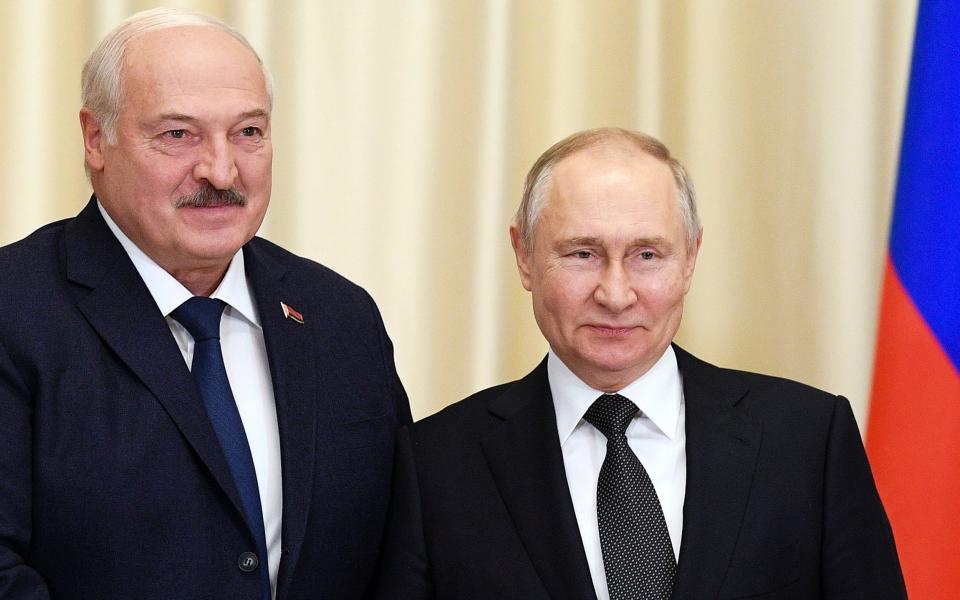 Russian President Vladimir Putin, right, and Belarusian President Alexander Lukashenko pose for a photo prior to their talks at the Novo-Ogaryovo state residence, outside Moscow, Russia, Friday, Feb. 17, 2023. (Vladimir Astapkovich, Sputnik, Kremlin Pool Photo via AP) - Vladimir Astapkovich, Sputnik, Kremlin Pool Photo via AP