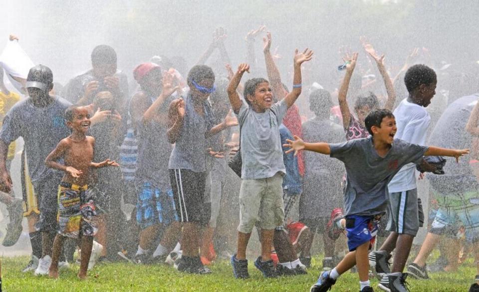 Campers from African Square, Jose Marti, Legion Park and Southside Park cool off during a city of Miami Parks and Recreation End of Summer picnic at Morningside Park in 2013.