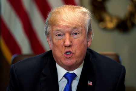 U.S. President Donald Trump delivers remarks to reporters at the start of a cabinet meeting at the White House in Washington, U.S., December 20, 2017. REUTERS/Jonathan Ernst