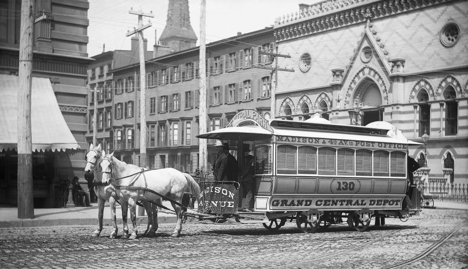 A horse-drawn tram along 23rd Street and 4th Avenue in New York City.