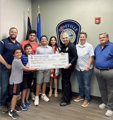 Dr. Tareen and her children visited the Roseville Police Department to deliver the donation check.