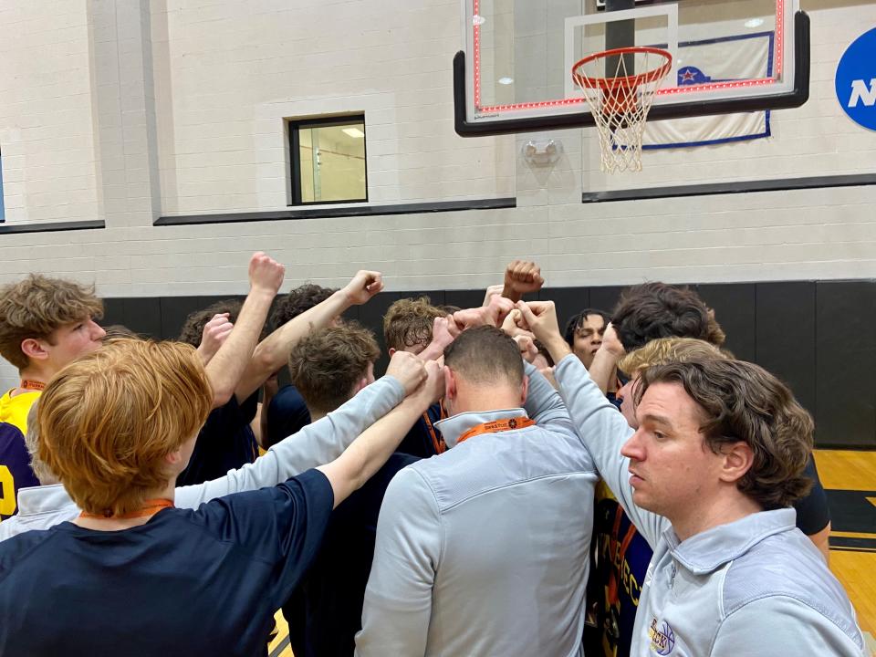 The Rhinebeck boys basketball team in its celebratory breakdown huddle after winning the Section 9 Class C championship Sunday at Bard College.