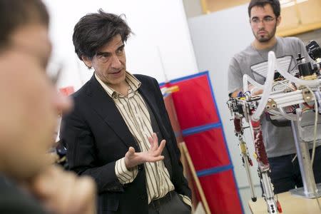 Prof. Marko Popovic describes quadruped robot "Hydro Dog", made by undergraduate seniors in his lab at Worcester Polytechnic Institute in Worcester, Massachusetts, March 20, 2015. REUTERS/Dominick Reuter