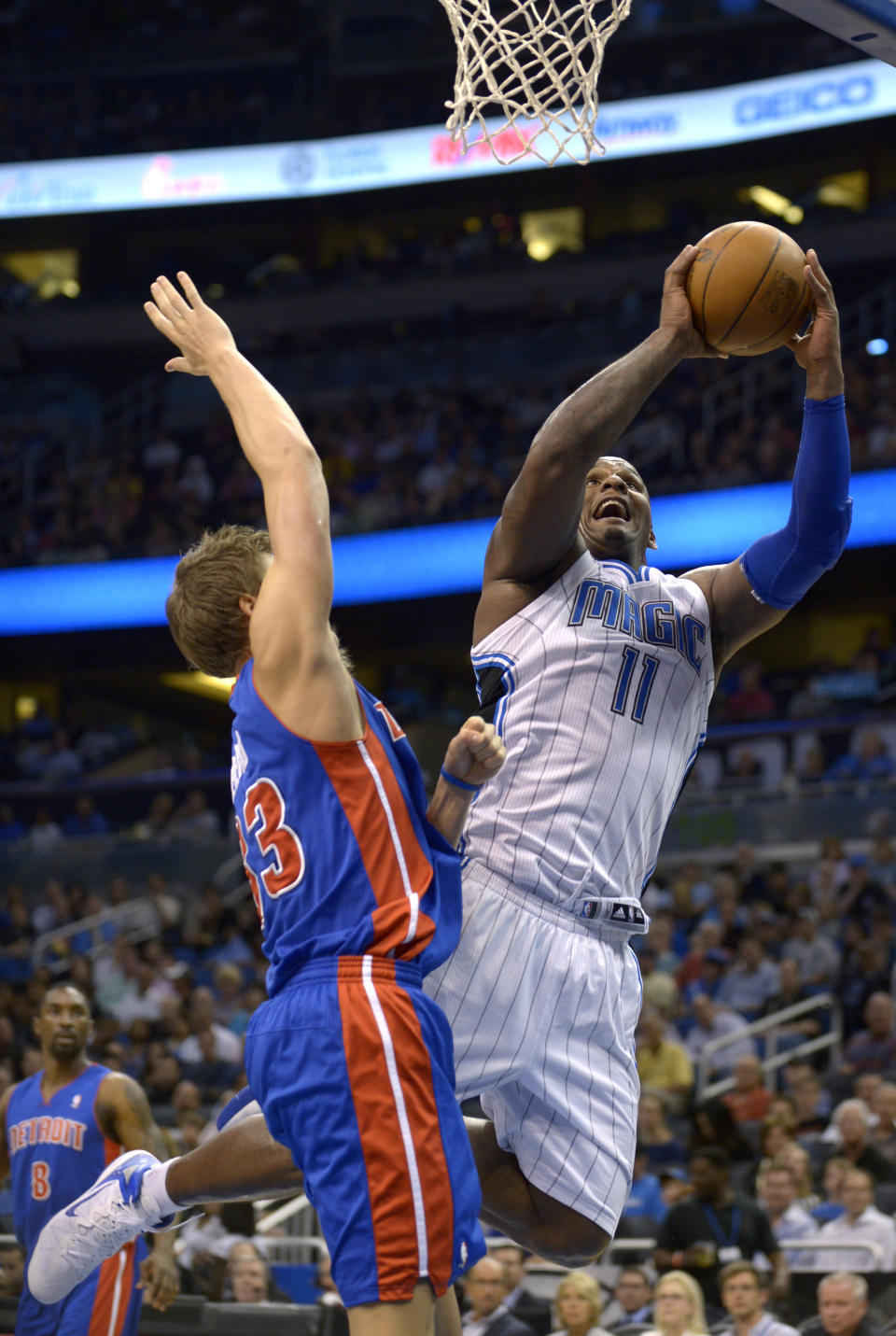 Orlando Magic center Glen Davis, right, puts up a shot in front of Detroit Pistons forward Jonas Jerebko, of Sweden, during the first half of an NBA basketball game in Orlando, Fla., Monday, April 9, 2012. (AP Photo/Phelan M. Ebenhack)