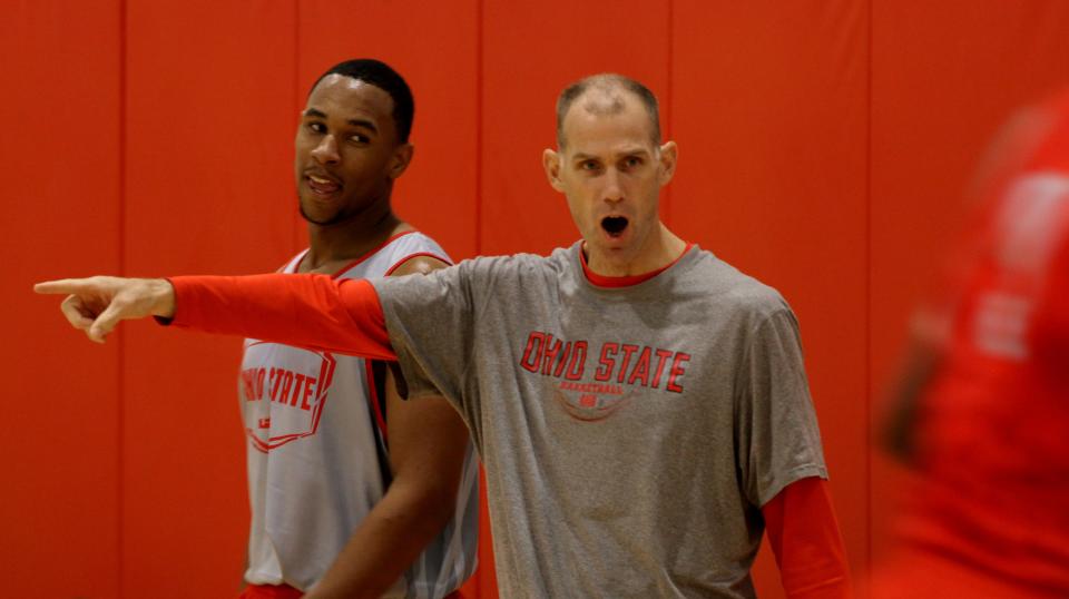 OSU assistant coach Chris Jent encourages players while Jared Sullinger keeps a eye Coach Chris Jent at practice Oct. 19, 2011. (Dispatch photo by Eric Albrecht)