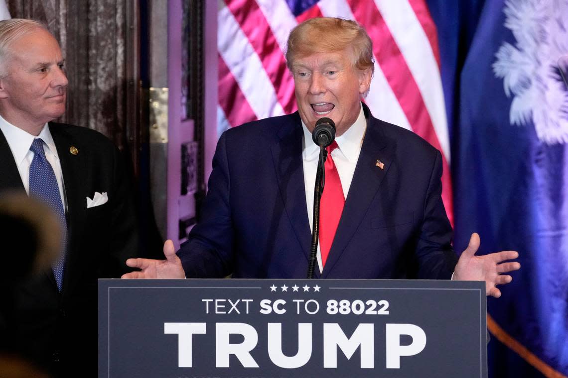 Former President Donald Trump speaks at a campaign event at the South Carolina Statehouse, Saturday, Jan. 28, 2023, in Columbia, S.C. South Carolina Gov. Henry McMaster, listens at left. (AP Photo/Alex Brandon)