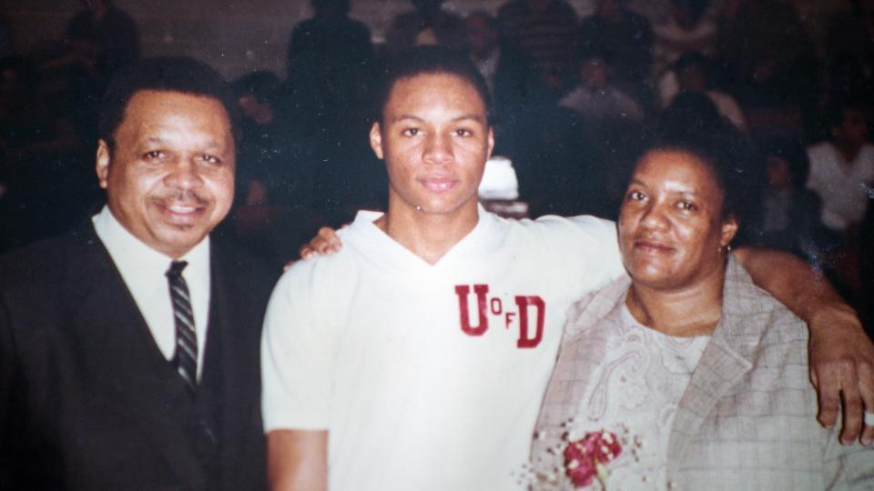 A photo of Gus Johnson with his parents during his years as a University of Detroit Jesuit High School student and star athlete.