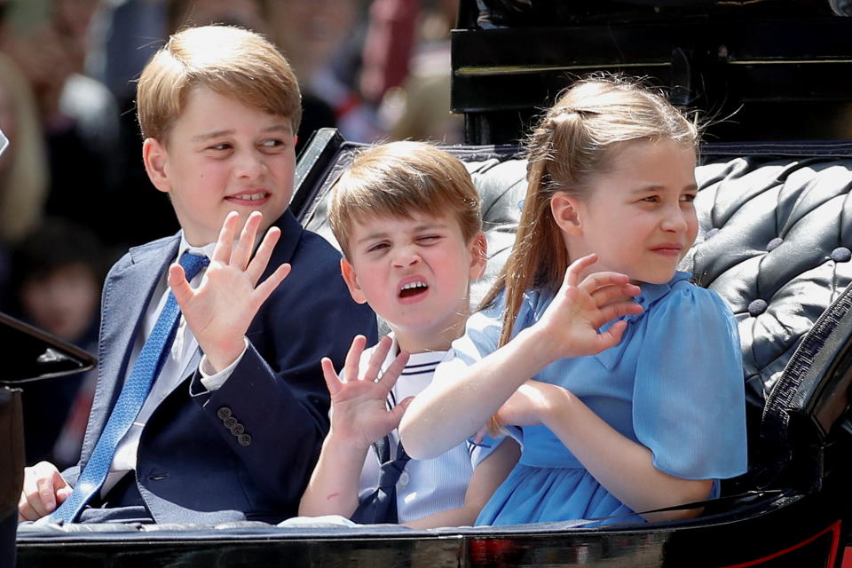 Britain's Prince George, Prince Louis and Princess Charlotte ride in a carriage as they attend the celebration of Britain's Queen Elizabeth's Platinum Jubilee, in London, Britain, June 2, 2022.  REUTERS/Peter Nicholls