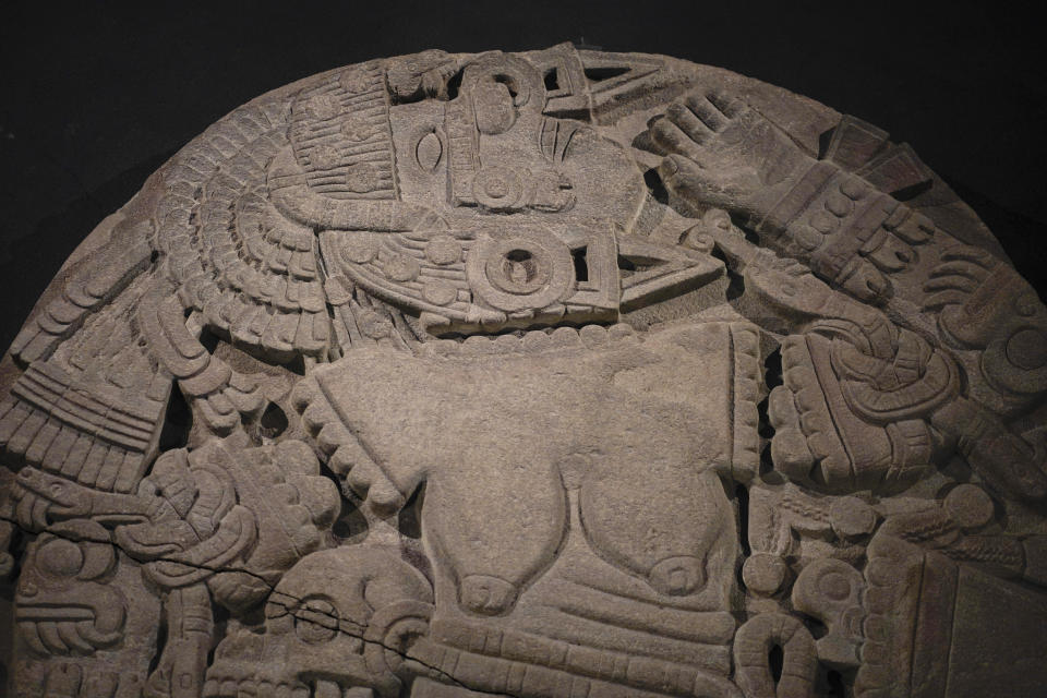 A partial view of the monolith depicting Coyolxauhqui, on exhibit at the Museum of Templo Mayor, marking the 45th anniversary of the circular stone’s discovery, in Mexico City, Wednesday, March 29, 2023. “Coyolxauhqui: The star, the goddess, the discovery” exhibition displays more than 150 archaeological objects focused on the mythology, symbolism and scientific research around the Mexica lunar goddess. (AP Photo/Eduardo Verdugo)